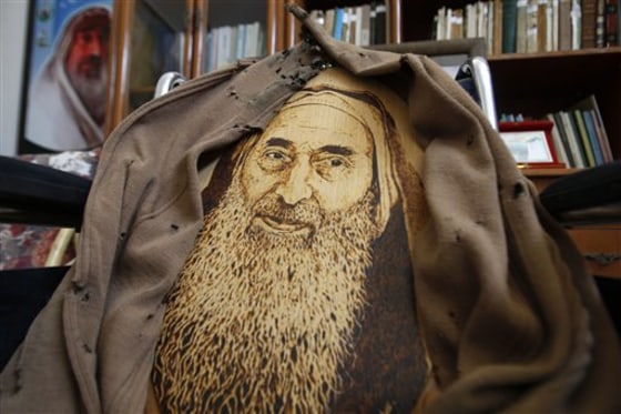 A portrait of Hamas founder and spiritual leader Sheik Ahmed Yassin is seen on a wheelchair at his house in Gaza City, Monday, May 30, 2011. Hamas and the Yassin's family opened his home to visitors, turning the location into a memorial site. Yassin was killed in an Israeli airstrike in 2004. (AP Photo/Hatem Moussa)